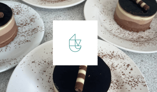 An image of trent vineyards logo on top of a triple chocolate cheesecake